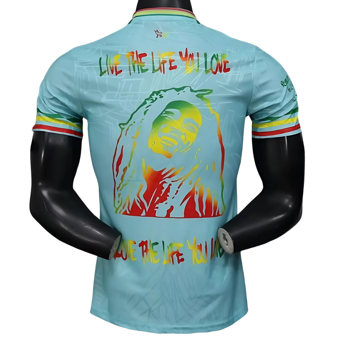 Camiseta Ajax 25/26 Edición Especial Bob Marley Celeste