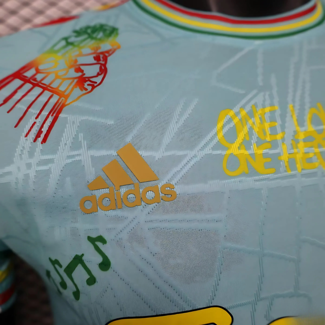 Camiseta Ajax 25/26 Edición Especial Bob Marley Celeste