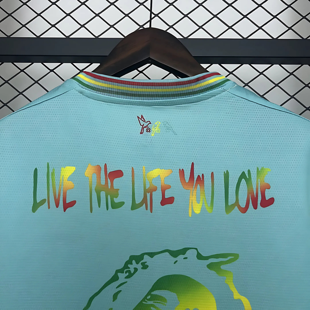 Camiseta Ajax 25/26 Edición Especial Bob Marley Celeste